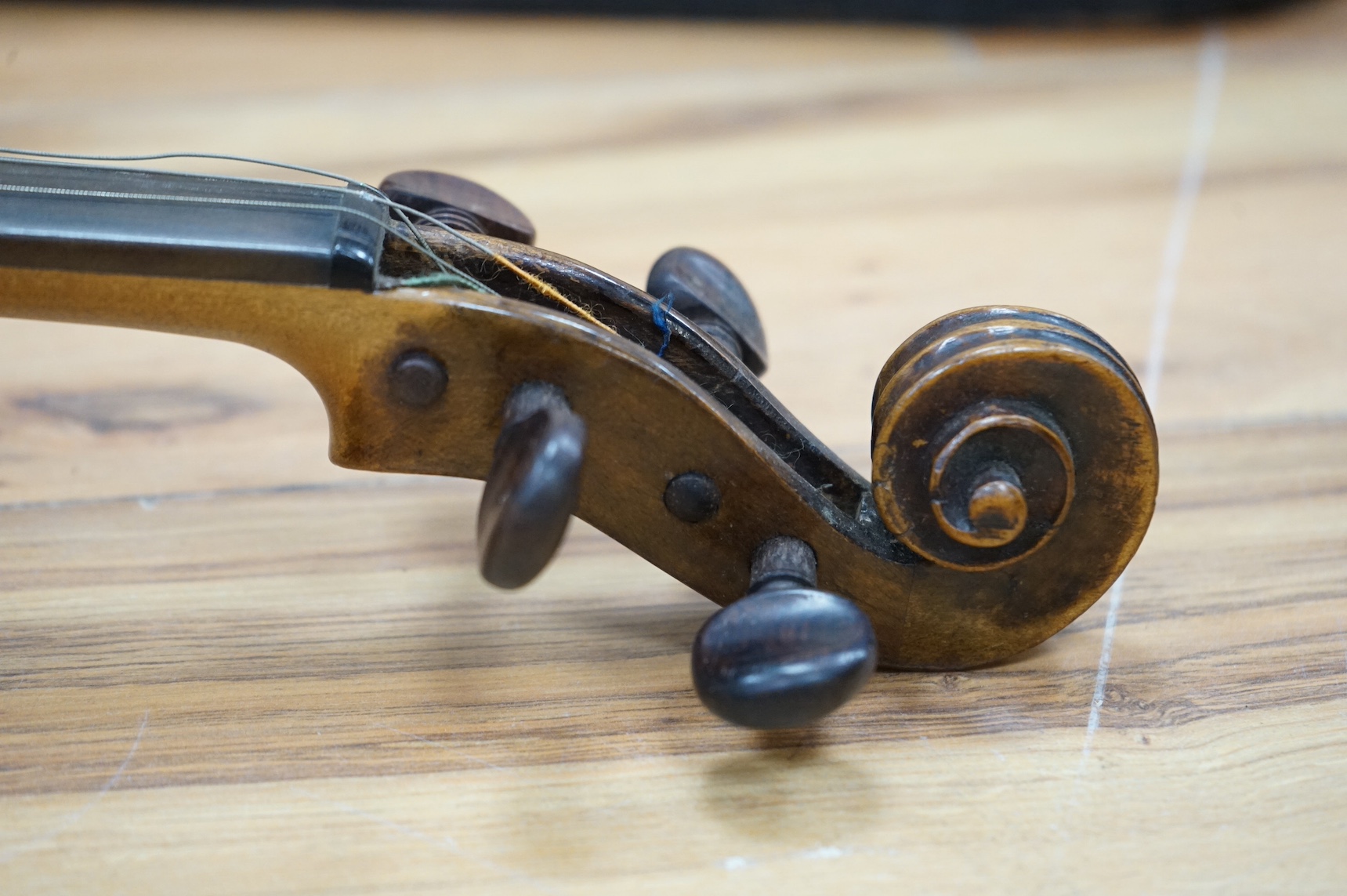 A cased 19th century French violin, back, 36cm. Condition - fair